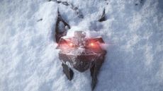 A lynx medallion partially covered in the snow, its red eyes glowing