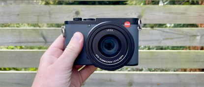 Leica Q3 43 camera front, in hand