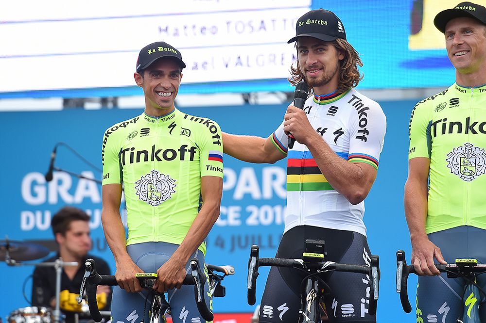 Peter Sagan presents teammate Alberto Contador to the crowd.