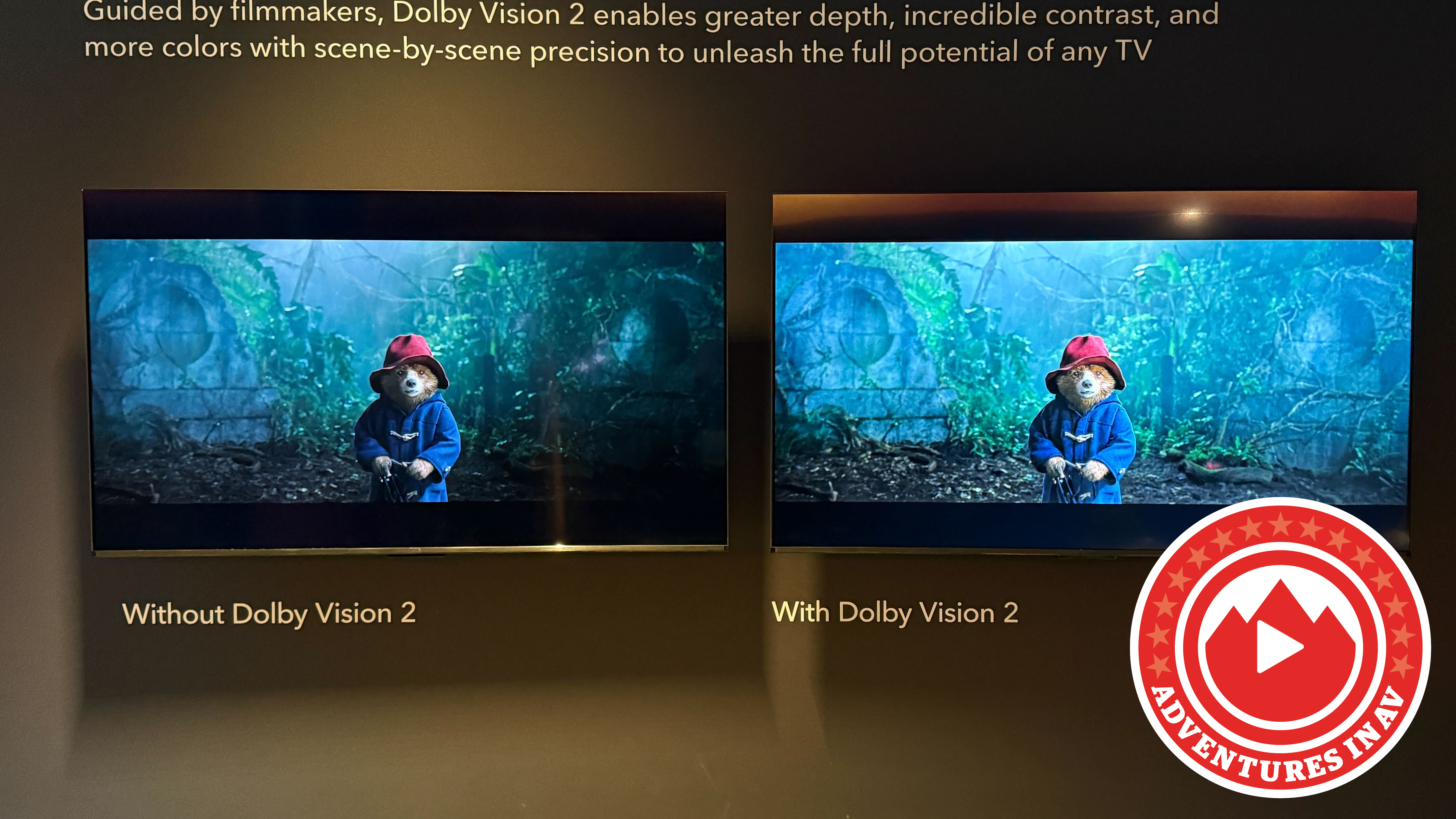 Two TVs side by side, one with Dolby Vision and the other with Dolby Vision 2 showing a scene from Paddington in Peru