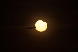Plane Crosses Solar Eclipse of March 8, 2016
