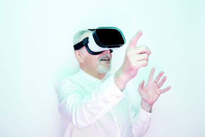 A man uses a virtual reality headset. 