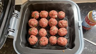 Uncooked meatballs on the Ninja Speedi's crisper tray
