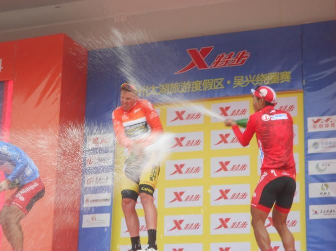 The jersey wearers enjoy their moment on the podium