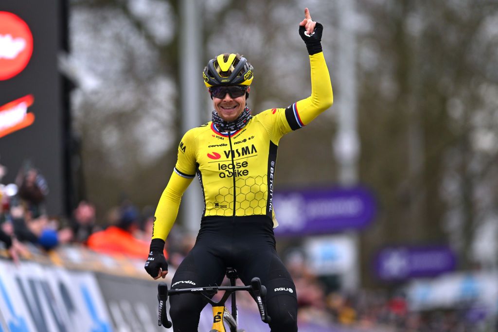 NINOVE BELGIUM FEBRUARY 24 Jan Tratnik of Slovenia and Team Visma Lease A Bike celebrates at finish line as race winner during the 79th Omloop Het Nieuwsblad 2024 Mens Elite a 2022km one day race from Ghent to Ninove UCIWT on February 24 2024 in Ninove Belgium Photo by Luc ClaessenGetty Images