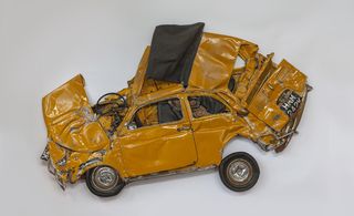 Crushed yellow car