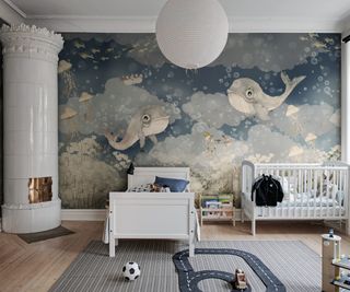 bedroom with wallpaper mural showing whales and mermaids