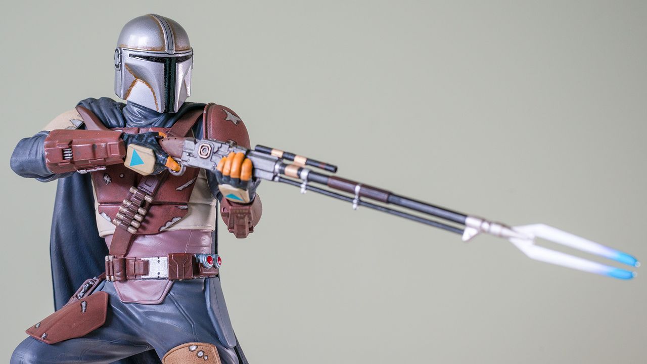 A close-up of the blaster rifle on the Gentle Giant Mandalorian 1:7 scale statue