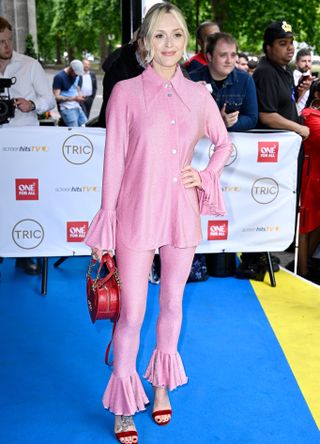 Fearne Cotton in pink suit with heart bag