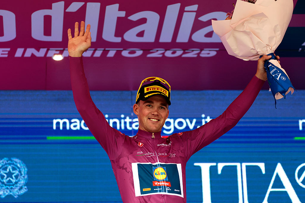 Lidl-Trek's Danish rider Mads Pedersen wears the cyclamen jersey of best sprinter on the podium after the first stage of the 108th Giro d'Italia cycling race, 160km from Durres to Tirana in Albania, on May 9, 2025. (Photo by Luca Bettini / AFP)