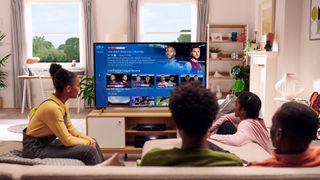 A family watching Sky Q on their tv