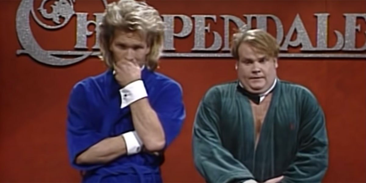 Chris Farley and Patrick Swayze standing on stage in robes during an SNL sketch about Chippendale&#039;s.