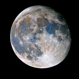 A close-up picture of the moon showing craters and texture, which has been colored with some white, blue, and grey/yellow areas which makes it look like a planet