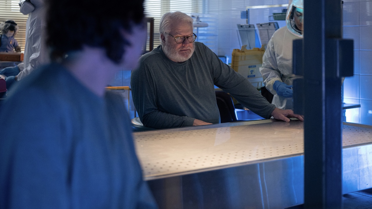 Rosie in quarantine looking over at Bluebird in NCIS: Sydney