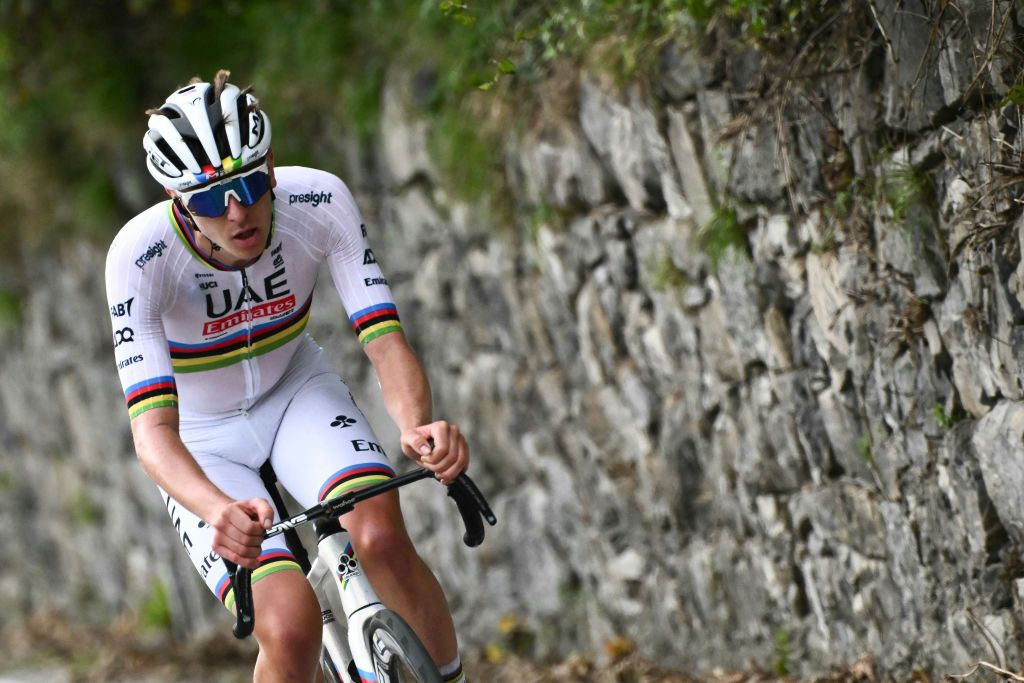 UAE Team Emirates team's Slovenian rider Tadej Pogacar attacks, to take the lead in a lone breakaway in the Colma Di Sormano ascent during the 118th edition of the Giro di Lombardia (Tour of Lombardy), a 252km cycling race from Bergamo to Como on October 12, 2024. (Photo by Marco BERTORELLO / AFP)