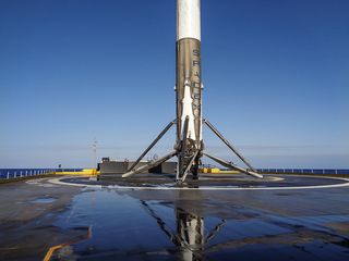 The first stage of SpaceX's Falcon 9 rocket sits on the deck of the drone ship "Of Course I Still Love You" after its successful landing on May 6, 2016.