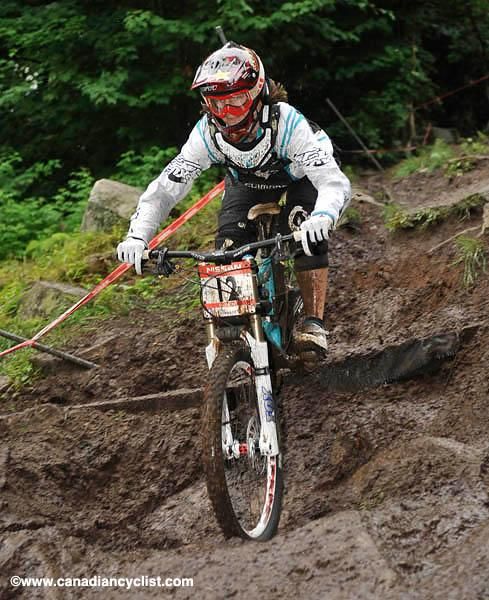 Anita Molcik tackles the muddy descent.