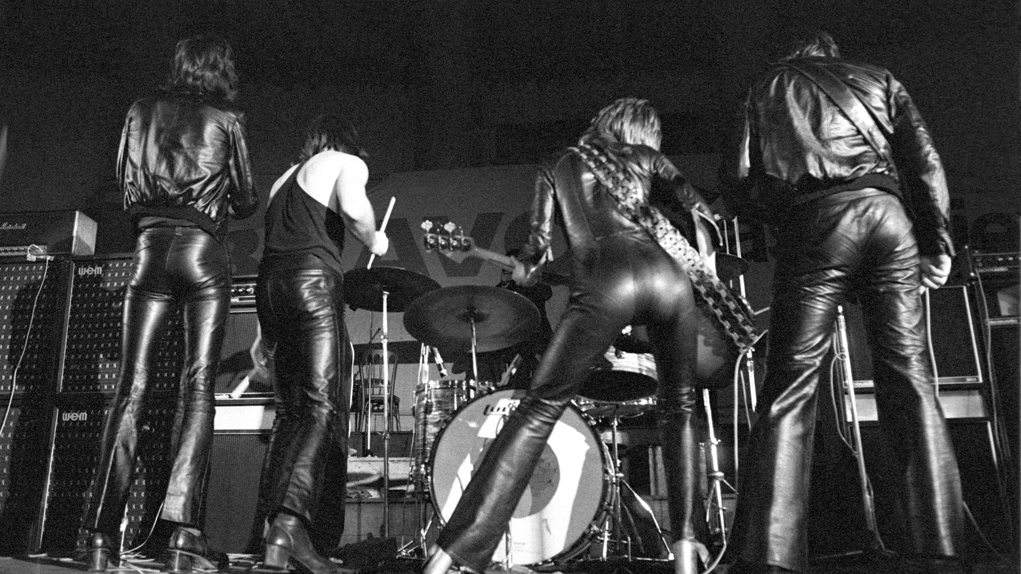 Suzi Quatro performing on stage with her band, United Kingdom, 1974.