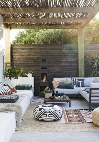 deck with garden sofas and fire pit