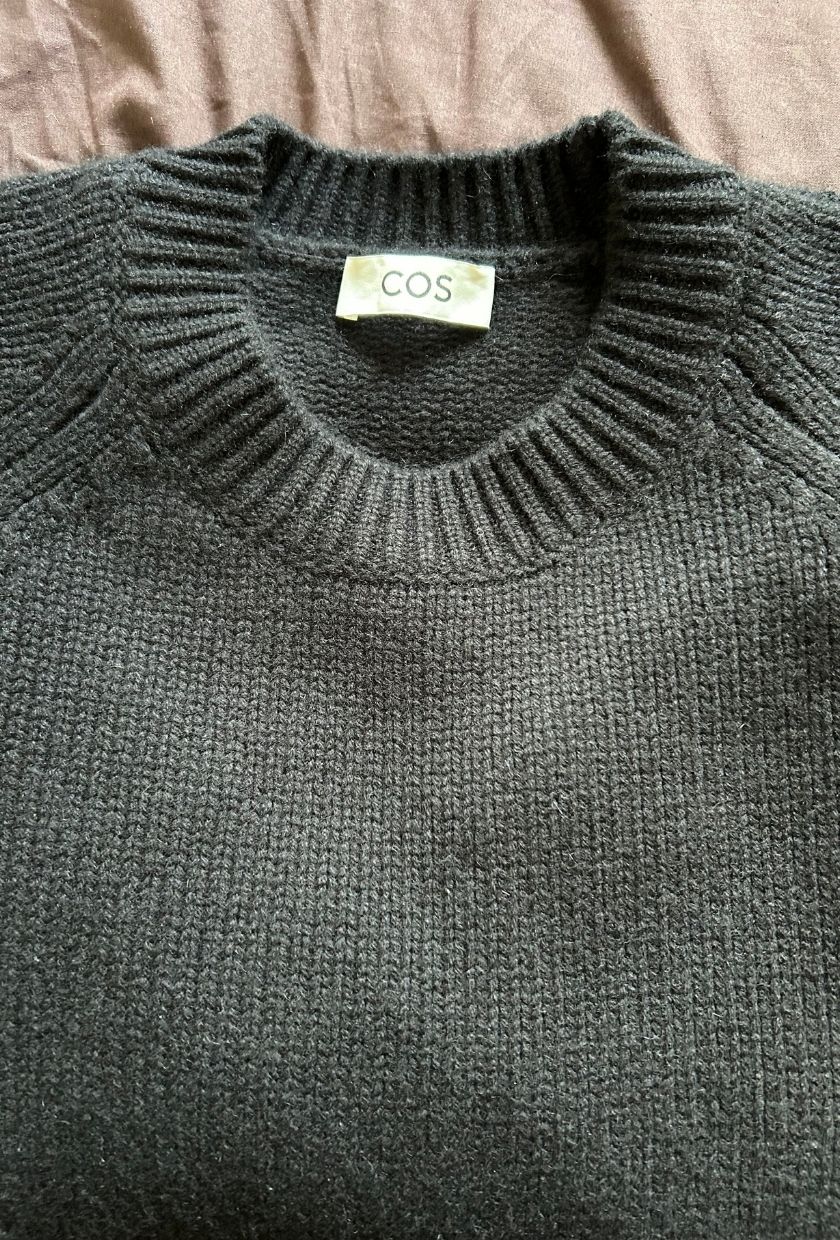 Who What Wear UK's Brittany Davy wearing the black COS Rounded Wool Crew-Neck Jumper in a Size M