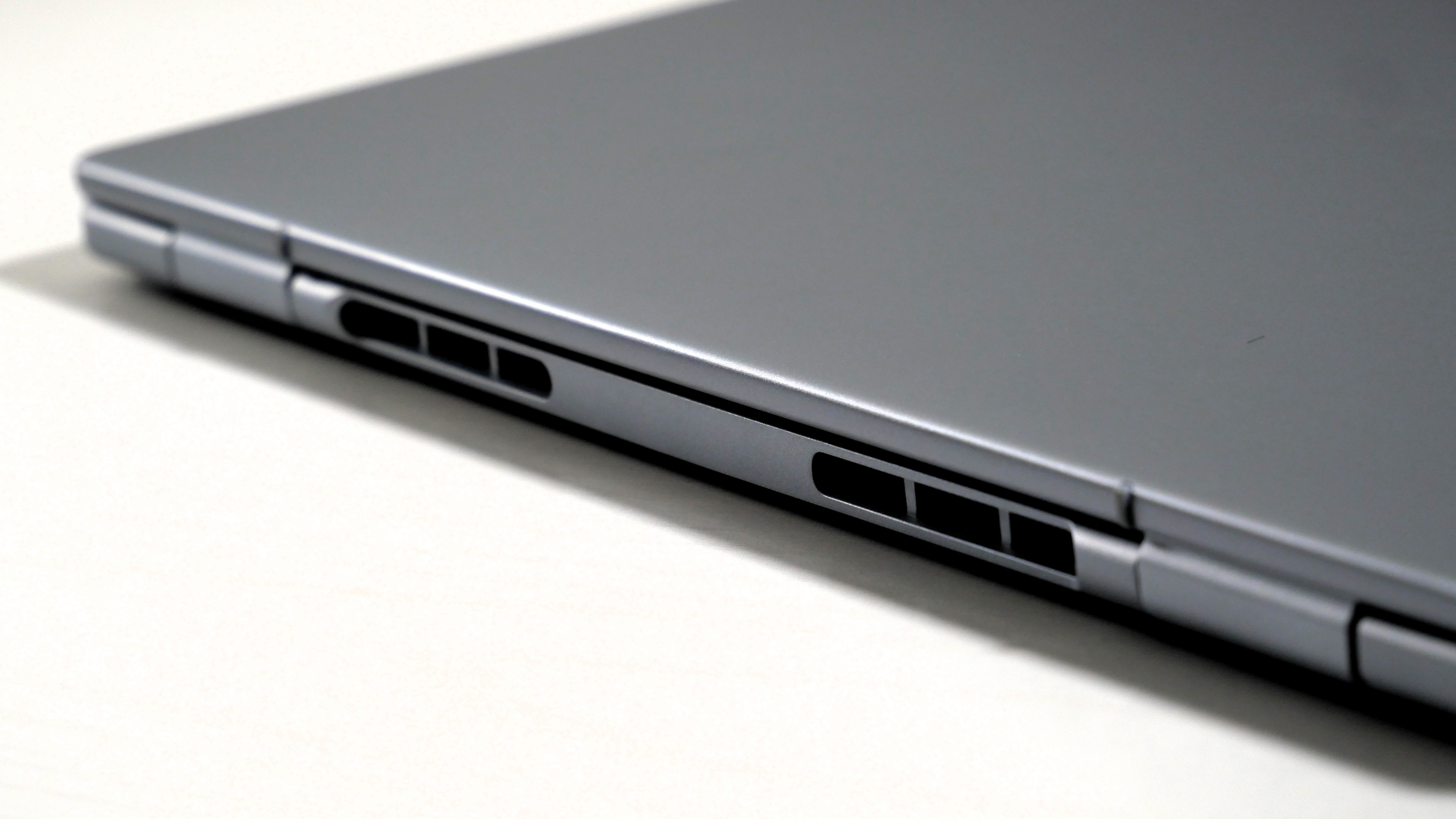 Dell 14 Plus laying flat on a table, highlighting its hinge.