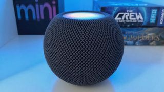 HomePod mini touch panel illuminated.