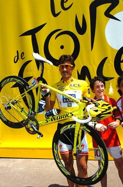 Swiss Fabian Cancellara (Saxo Bank) shows off his yellow bike.