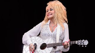 Dolly Parton performs on the Pyramid Stage, on the final day of the Glastonbury Festival of Music and Performing Arts on Worthy Farm in Somerset, England, on June 29, 2014