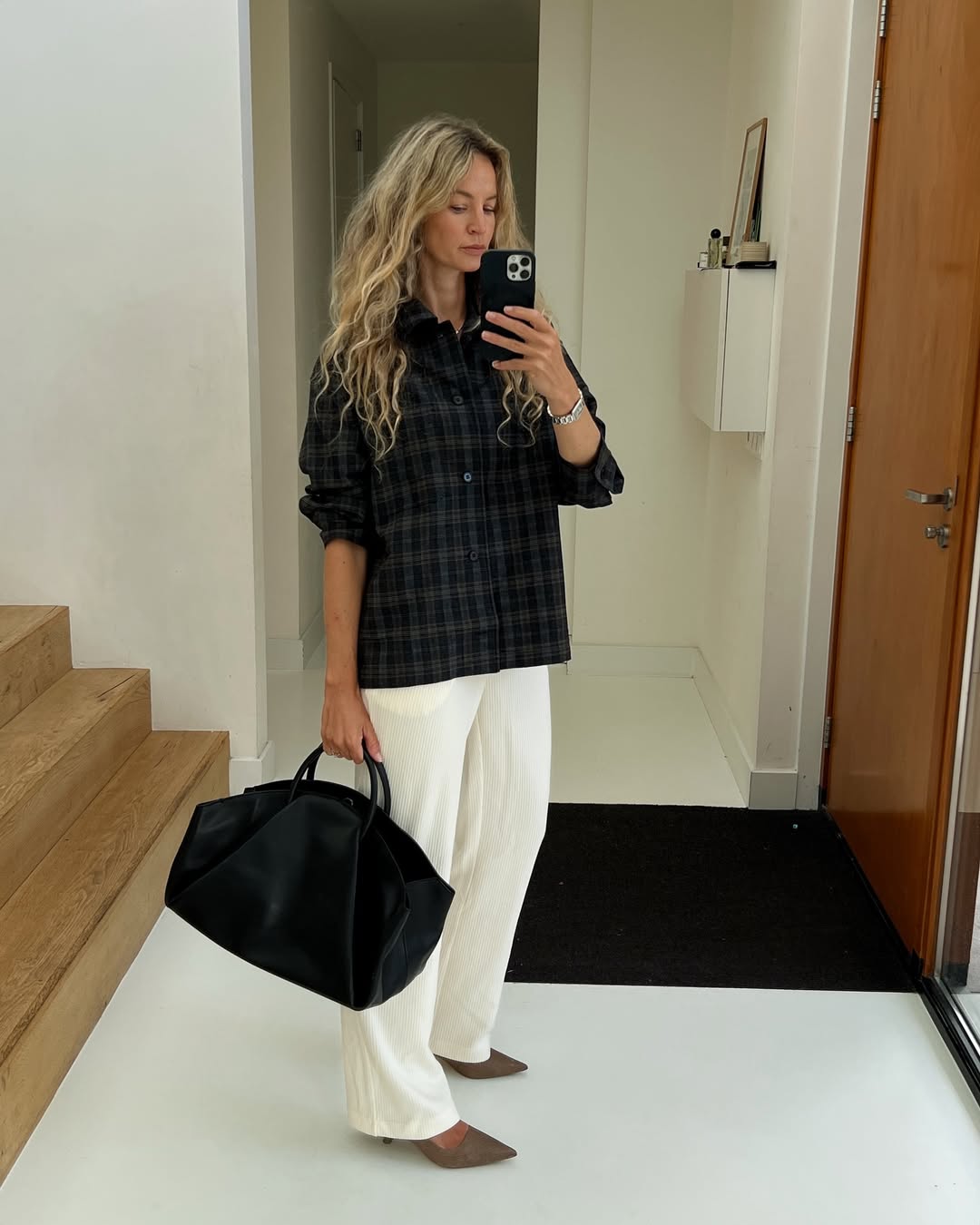 @anoukyve wears flannel shirt white trousers