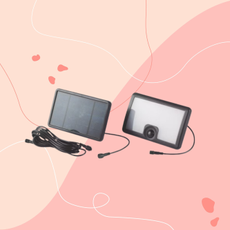 Aldi solar floodlight on pink background.