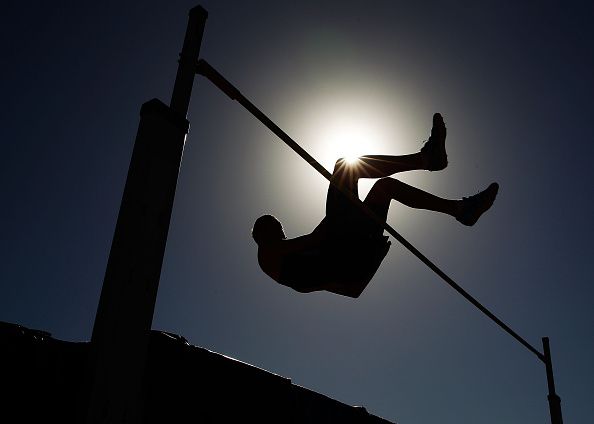 An athlete performs the High Jump at the Australian Junior Athletics Championships.