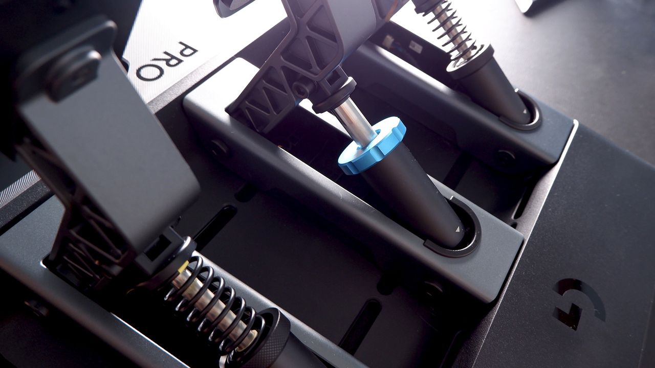 Logitech G Pro Racing Wheel and Pedals installed on a computer desk