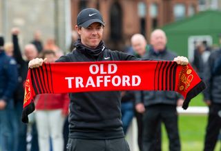 Manchester United fan Rory McIlroy poses with a scarf during a preview day ahead of the 2019 Alfred Dunhill links Championship, at the Old Course, on September 25, 2019, in St Andrews, Scotland