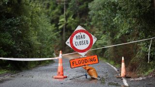 A road in Titirangi is closed with slips and flooding on January 30, 2023 in Auckland, New Zealand