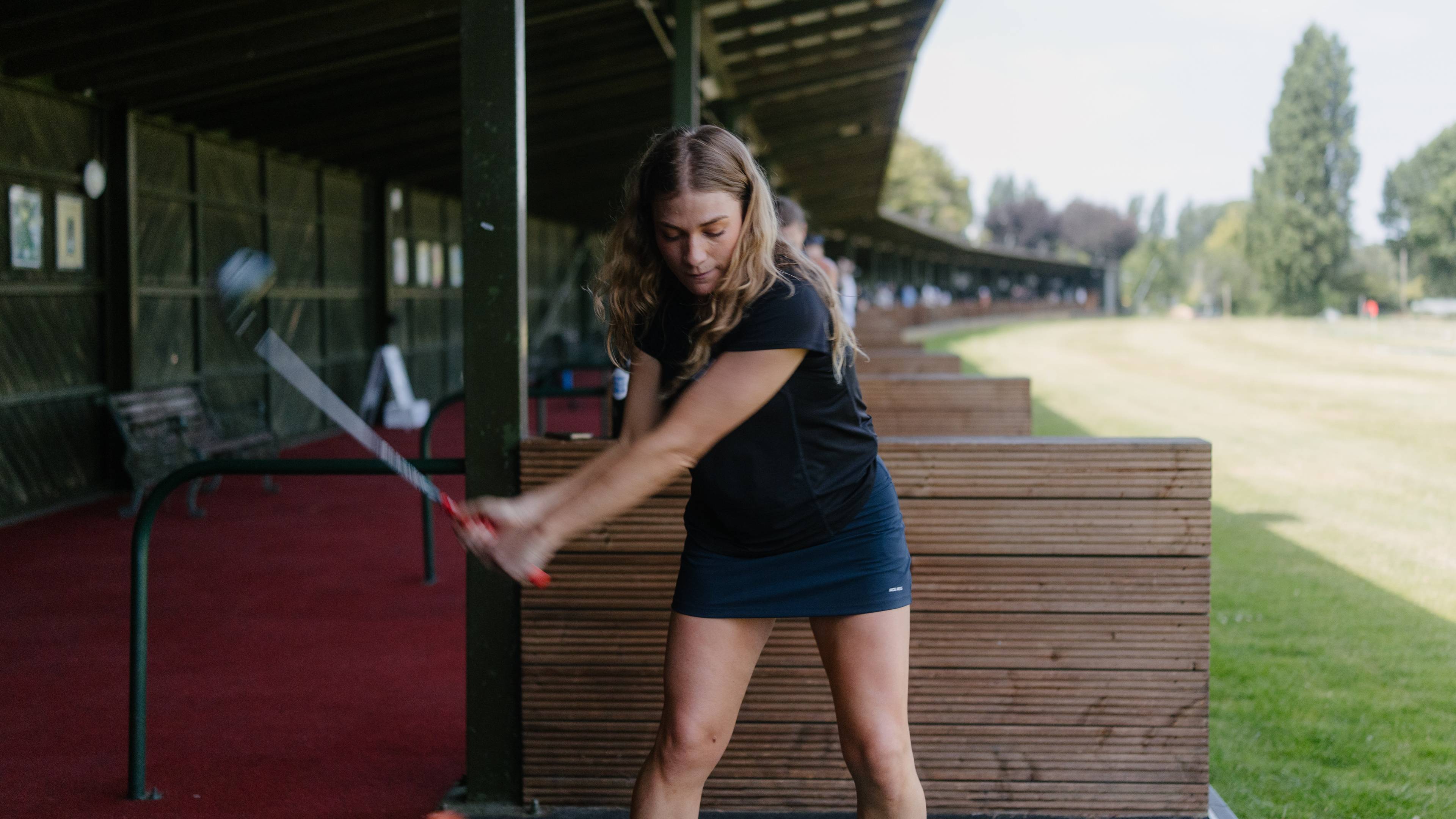 Female golfer on the driving range