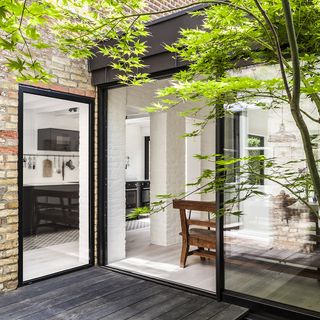 brick house with wooden flooring and glass slide