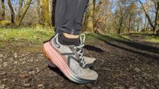 A runner's feet wearing the Keen Seek trail running shoes