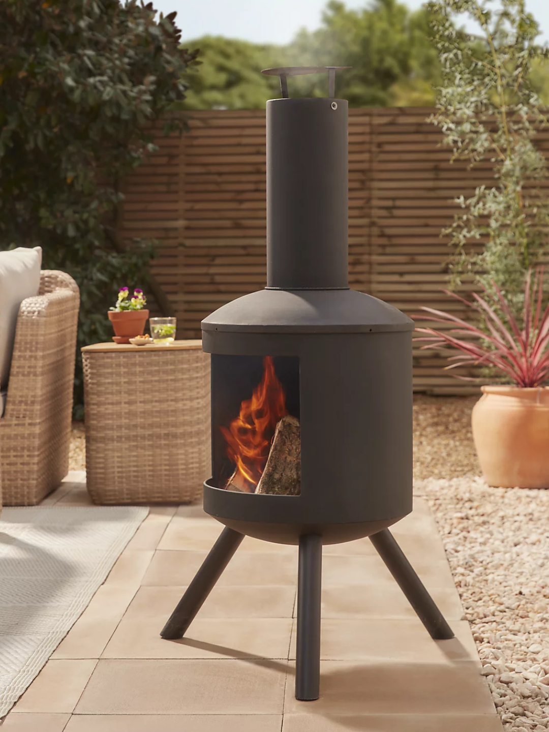 A black chiminea on a patio