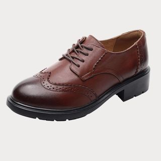 Flat lay image of brown shoes