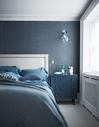 Blue bedroom with texture wallpaper