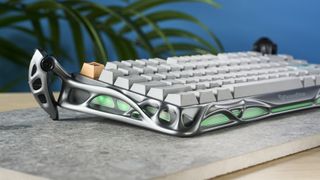 A gray GravaStar Mercury K1 Pro mechanical keyboard, with spider legs