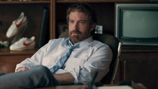 Ben Affleck sits back at his desk with an assured expression in Air.