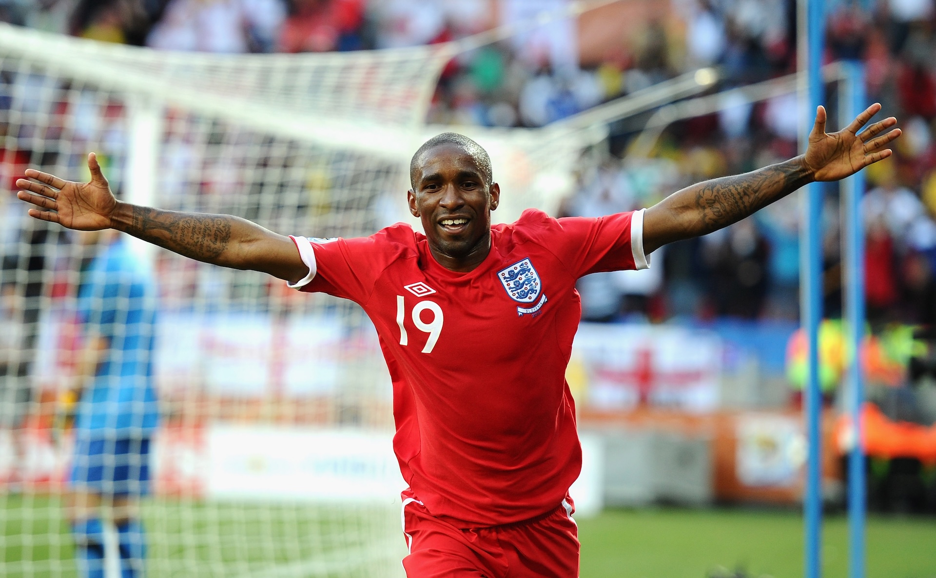 Jermain Defoe of England celebrates scoring the opening goal during the 2010 FIFA World Cup South Africa Group C match between Slovenia and England