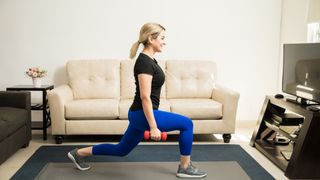 Woman performing a dumbbell lunge