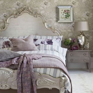 bedroom with silver colour bed and wallpaper wall