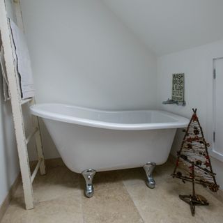 A bathroom with a bathtub and a Christmas tree