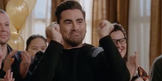 David cheering on Alexis and Ted in Schitt's Creek.