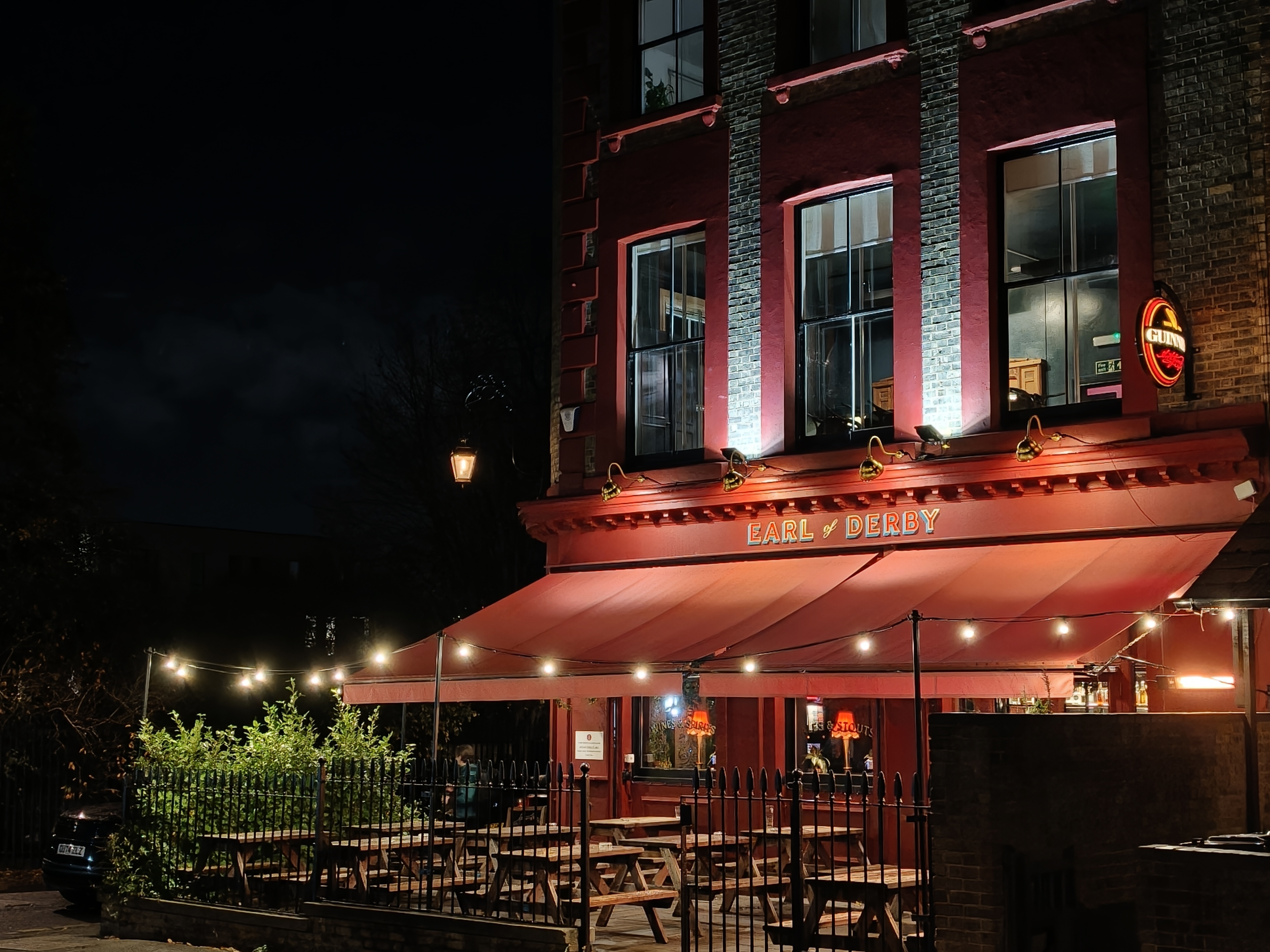 A pub lit up at night