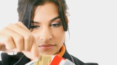 Close-up of a businesswoman choosing a credit card from a bunch