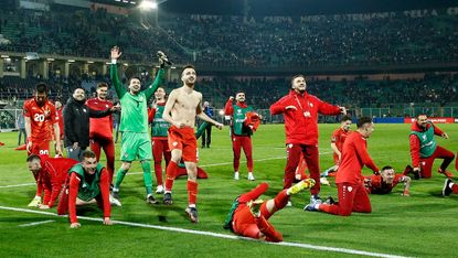 North Macedonia players celebrate their victory over Italy in the World Cup play-off